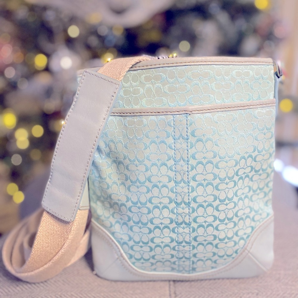 Coach canvas cross body. Light Tiffany blue color. Used condition clean inside.